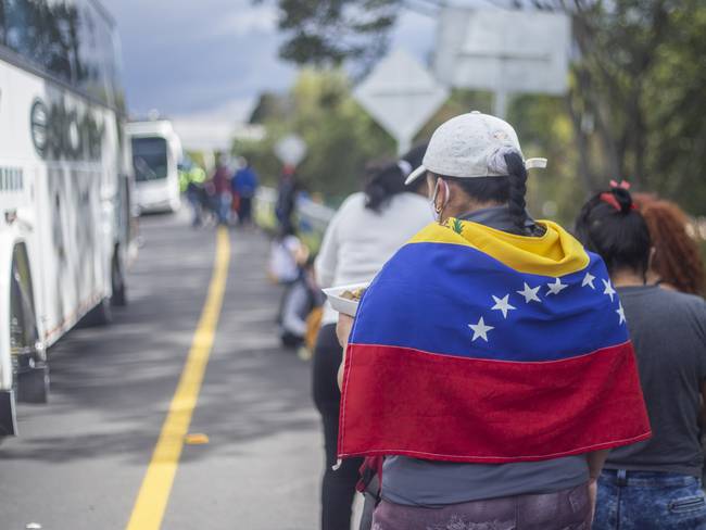 Hundreds of Venezuelan migrants saved to pay for the bus trip that would take them back to their country. However, today they are detained by the authorities at the Los Andes toll located on the North highway in Bogota, Colombia, on April 29, 2020. (Photo by Daniel Garzon Herazo/NurPhoto via Getty Images)
