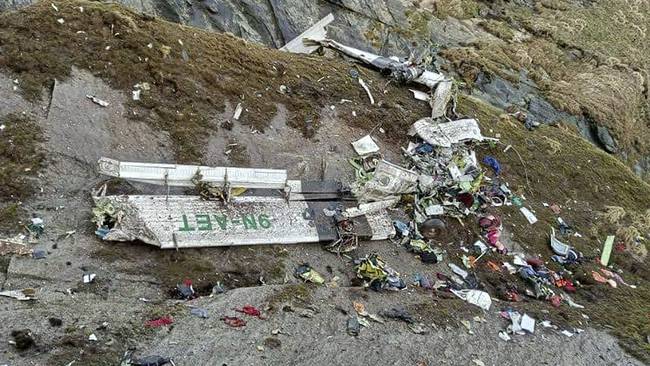 Nepali rescuers pulled 14 bodies on May 30 from the mangled wreckage of a passenger plane strewn across a mountainside that went missing in the Himalayas with 22 people on board. (Photo by BISHAL MAGAR / AFP) (Photo by BISHAL MAGAR/AFP via Getty Images)