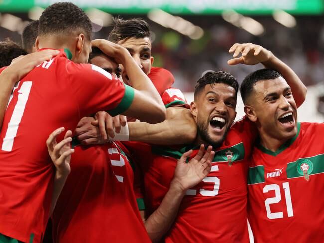 AL RAYYAN, QATAR - DECEMBER 06: Morocco players celebrate after their win in the penalty shoot out during the FIFA World Cup Qatar 2022 Round of 16 match between Morocco and Spain at Education City Stadium on December 06, 2022 in Al Rayyan, Qatar. (Photo by Catherine Ivill/Getty Images)
