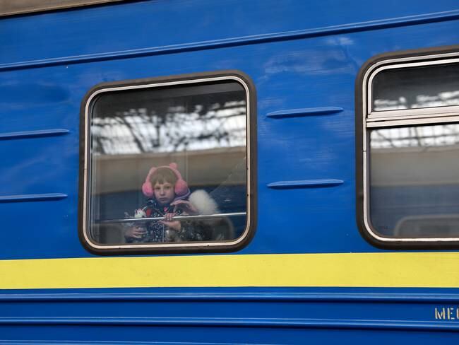 LVIV, UKRAINE- APRIL 05: A child looks out the window of a train as it arrives at the main train station from Zaporizhzhia on April 05, 2022 in Lviv, Ukrain. More than 4 million people have fled Ukraine since the Russian invasion of that country on February 24. Millions more have been internally displaced. (Photo by Joe Raedle/Getty Images)