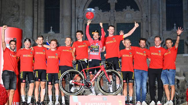 SANTIAGO DE COMPOSTELA, SPAIN - SEPTEMBER 05: Team Jumbo - Visma celebrate winning on the podium ceremony in the Plaza del Obradoiro with the Cathedral in the background after the 76th Tour of Spain 2021, Stage 21 a 33,8 km Individual Time Trial stage from Padrón to Santiago de Compostela / @lavuelta / #LaVuelta21 / ITT / on September 05, 2021 in Santiago de Compostela, Spain. (Photo by Stuart Franklin/Getty Images)