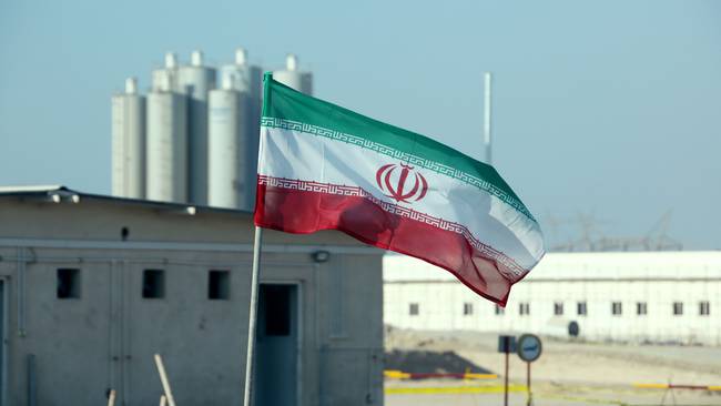 A picture taken on November 10, 2019, shows an Iranian flag in Iran&#039;s Bushehr nuclear power plant, during an official ceremony to kick-start works on a second reactor at the facility. - Bushehr is Iran&#039;s only nuclear power station and is currently running on imported fuel from Russia that is closely monitored by the UN&#039;s International Atomic Energy Agency. (Photo by ATTA KENARE / AFP) (Photo by ATTA KENARE/AFP via Getty Images)