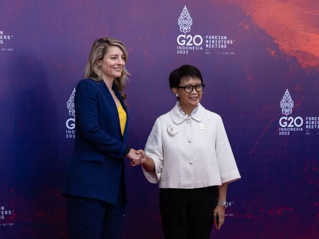 NUSA DUA, INDONESIA - JULY 08: The Indonesian Minister for Foreign Affairs, Retno Marsudi (R) greets the Minister for Foreign Affairs of Canada, Melanie Joly (L) during arrival of the G20 Foreign Ministers and Head of Department at the Grand Ballroom Mulia Hotel on July 08, 2022 in Nusa Dua, Indonesia. (Photo by Robertus Pudyanto/Getty Images)