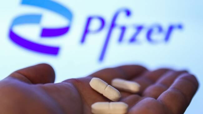 Medicine pills are seen with Pfizer logo displayed on a screen in the background in this illustration photo taken in Krakow, Poland on April 27, 2021. (Photo Illustration by Jakub Porzycki/NurPhoto via Getty Images)