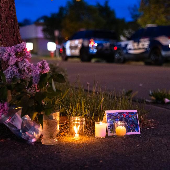 BUFFALO, NY - MAY 14: A small vigil set up across the street from a Tops grocery store on Jefferson Avenue in Buffalo, where a heavily armed 18-year-old White man entered the store in a predominantly Black neighborhood and shot 13 people, killing ten, Saturday, May 14, 2022. (Matt Burkhartt for The Washington Post via Getty Images)