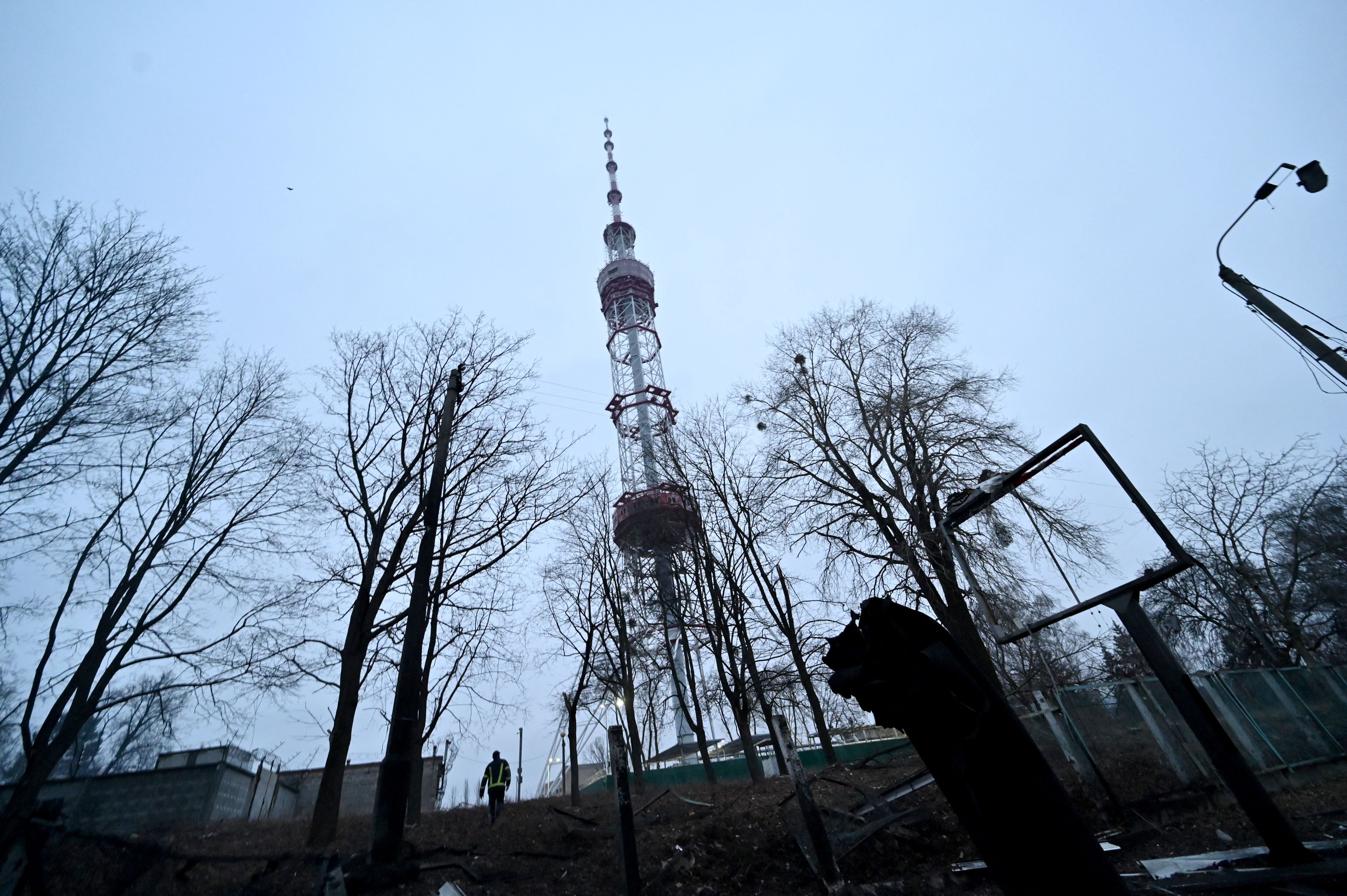 A fireman walks past fragments of missile after Russian airstrike hit Kyiv's main television tower in Kyiv on March 1, 2022 - An apparent Russian airstrike hit Kyiv's main television tower in the heart of the Ukrainian capital on March 1, 2022. (Photo by Sergei SUPINSKY / AFP) (Photo by SERGEI SUPINSKY/AFP via Getty Images)