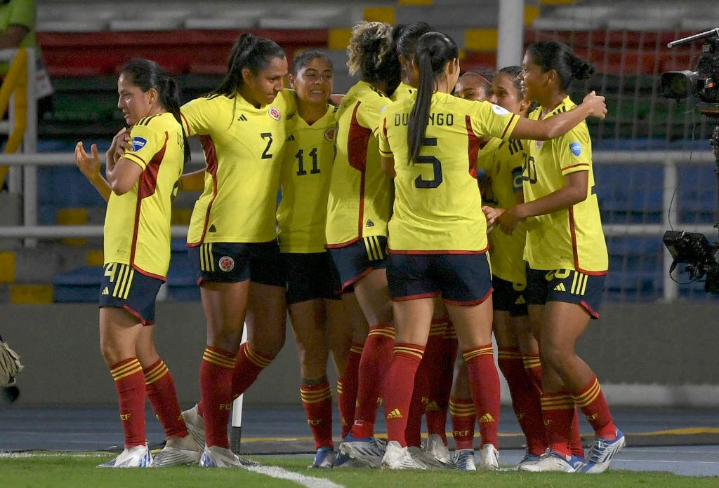 Colombian players celebrate after scoring against Bolivia during their Women's Copa America first round match at Pascual Guerrero Stadium in Cali, Colombia, on July 11, 2022. (Photo by Juan BARRETO / AFP) (Photo by JUAN BARRETO/AFP via Getty Images)