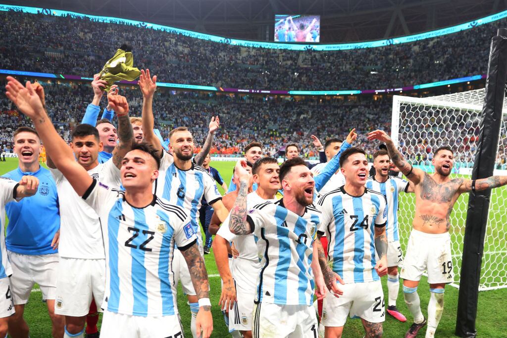 LUSAIL CITY, QATAR - DECEMBER 09: Argentina's Lionel Messi celebrates with his teammates after winning the FIFA World Cup Qatar 2022 quarter final match between Netherlands and Argentina at Lusail Stadium on December 9, 2022 in Lusail City, Qatar. (Photo by Marc Atkins/Getty Images)