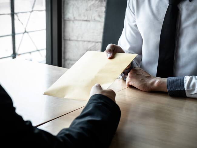 Dishonest cheating in business illegal money, Businessman receive bribe money in envelope to business people to give success the deal contract of investment, Bribery and corruption concept.