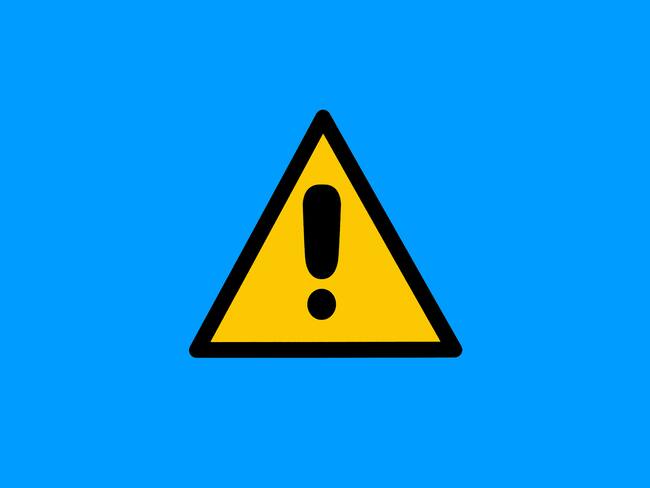 Warning sign with yellow and black triangle with exclamation mark, on blue background. Danger, risk, caution, attention, road sign and care concept.
