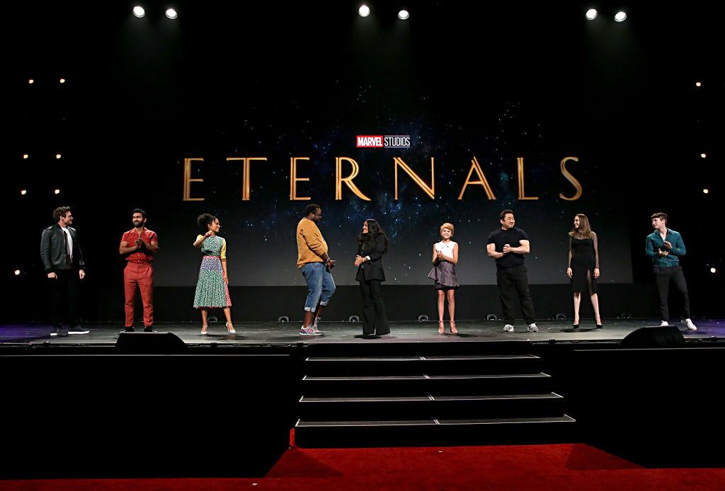 ANAHEIM, CALIFORNIA - AUGUST 24: (L-R) Richard Madden, Kumail Nanjiani, Lauren Ridloff, Salma Hayek, Lia McHugh, Don Lee, Angelina Jolie, and Barry Keoghan of 'The Eternals' took part today in the Walt Disney Studios presentation at Disney’s D23 EXPO 2019 in Anaheim, Calif.  'The Eternals' will be released in U.S. theaters on November 6, 2020. (Photo by Jesse Grant/Getty Images for Disney)