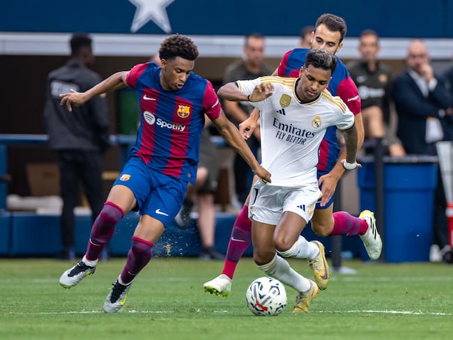 ARLINGTON, TX -  JULY 29: Real Madrid forward Rodrygo (#11) dribbles the ball up field as FC Barcelona defender Alex Balde (#3) defends during the Soccer Champions Tour match between Real Madrid and FC Barcelona on July 29, 2023 at AT&T Stadium in Arlington, TX.