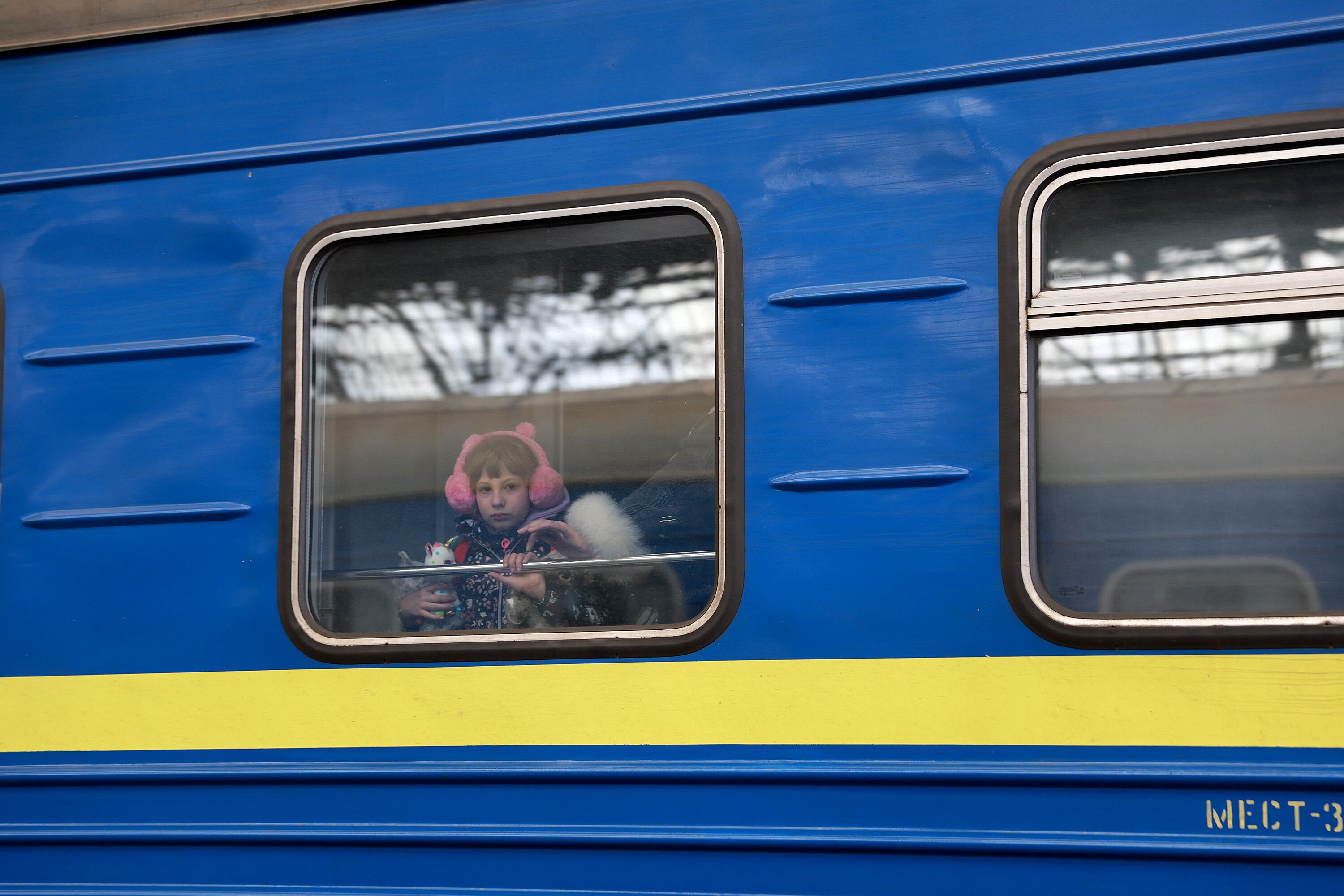 LVIV, UKRAINE- APRIL 05: A child looks out the window of a train as it arrives at the main train station from Zaporizhzhia on April 05, 2022 in Lviv, Ukrain. More than 4 million people have fled Ukraine since the Russian invasion of that country on February 24. Millions more have been internally displaced. (Photo by Joe Raedle/Getty Images)