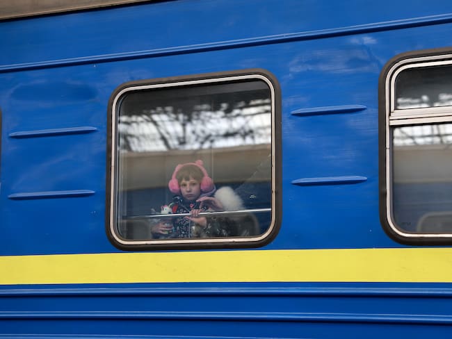 LVIV, UKRAINE- APRIL 05: A child looks out the window of a train as it arrives at the main train station from Zaporizhzhia on April 05, 2022 in Lviv, Ukrain. More than 4 million people have fled Ukraine since the Russian invasion of that country on February 24. Millions more have been internally displaced. (Photo by Joe Raedle/Getty Images)