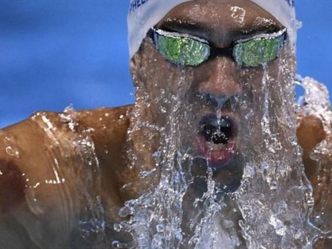 Michael ya va ganando tres medallas de oro en Río 2016: en relevos 4x100, 4x200 y en 200 metros mariposa. Foto: AFP / BBC Mundo.