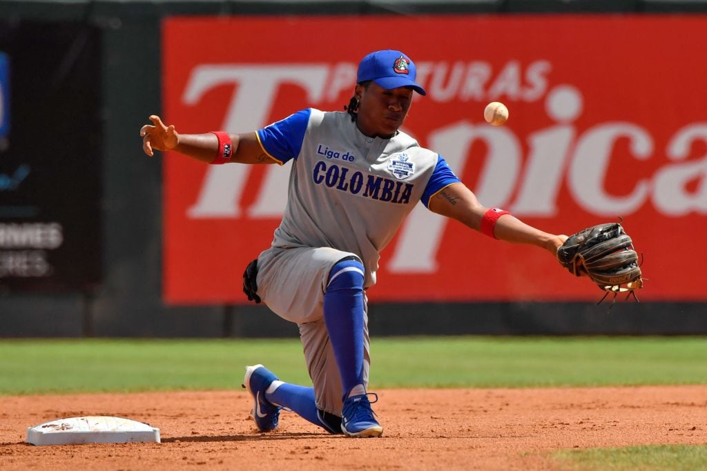 Colombia's player Carlos Arroyo fails to catch a ball during the Caribbean Series baseball match against Puerto Rico at the Quisqueya Juan Marichal stadium in Santo Domingo, on February 1, 2022. (Photo by Federico PARRA / AFP) (Photo by FEDERICO PARRA/AFP via Getty Images)