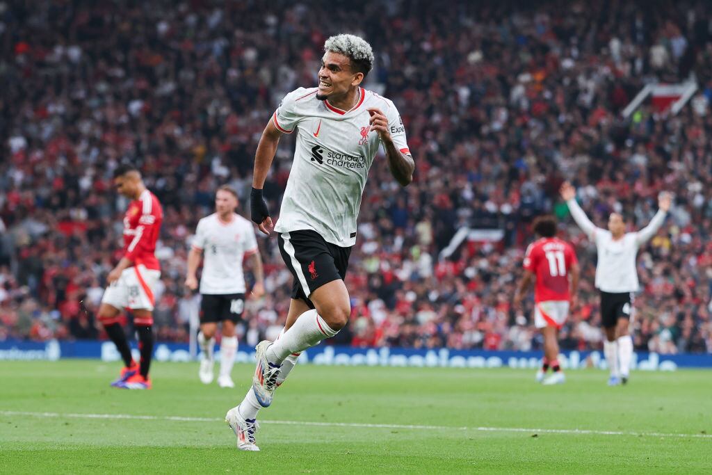 MANCHESTER, ENGLAND - SEPTEMBER 01: Luis Diaz of Liverpool celebrates after scoring his side's second goal during the Premier League match between Manchester United FC and Liverpool FC at Old Trafford on September 01, 2024 in Manchester, England. (Photo by James Gill - Danehouse/Getty Images)