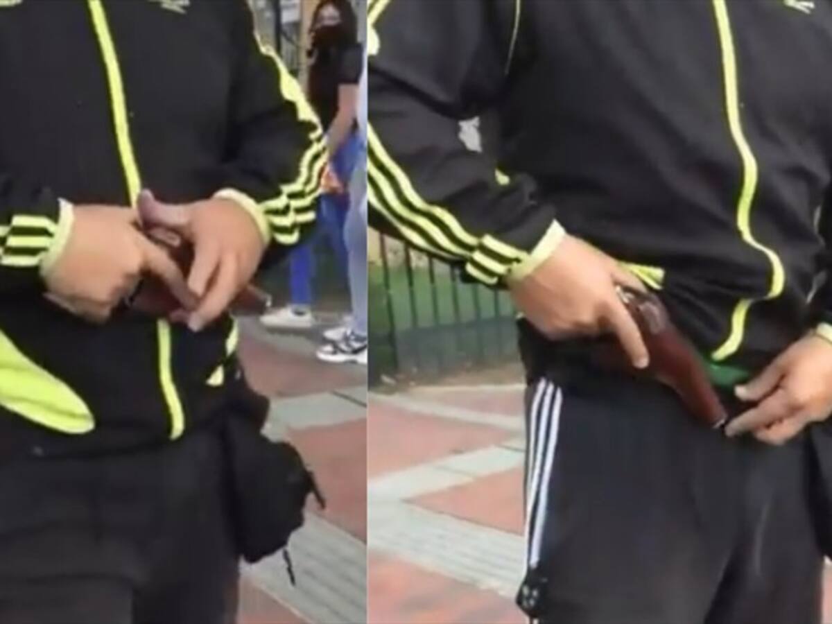 Video: Hombre amenaza con arma de fuego a grafiteros que pintan pared de su conjunto