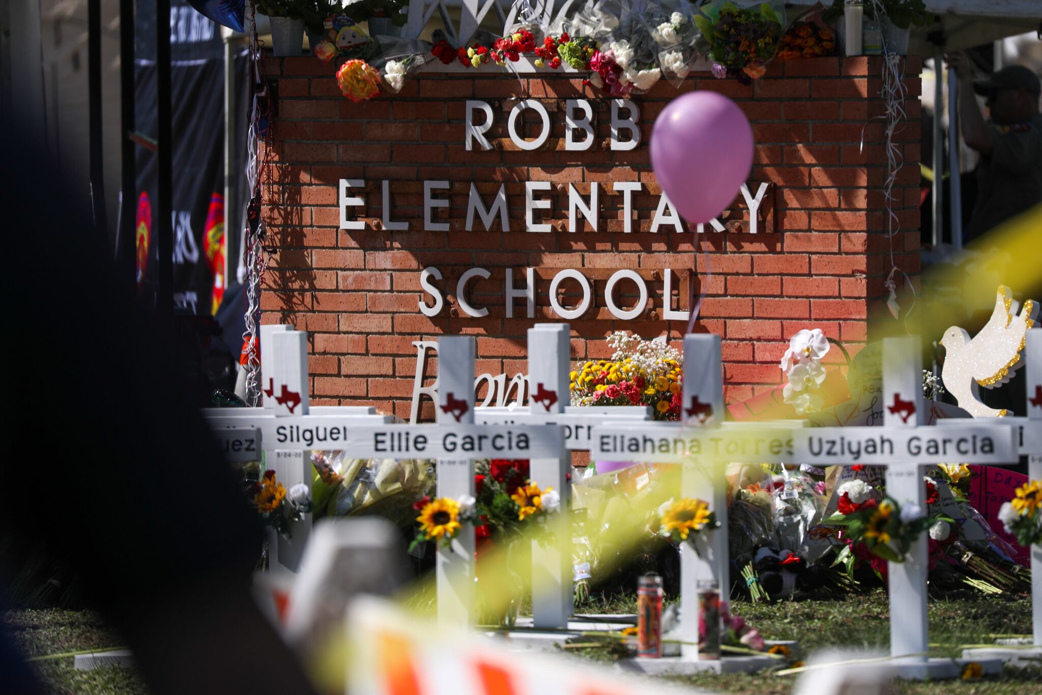 UVALDE,TEXAS, USA - MAY 25: A view from a makeshift memorial outside Robb Elementary School in Uvalde, Texas, on May 25, 2022. At least 19 students and two adults were killed at an elementary school in the US state of Texas on Wednesday when an 18-year-old gunman opened fire. (Photo by Yasin Ozturk/Anadolu Agency via Getty Images)
