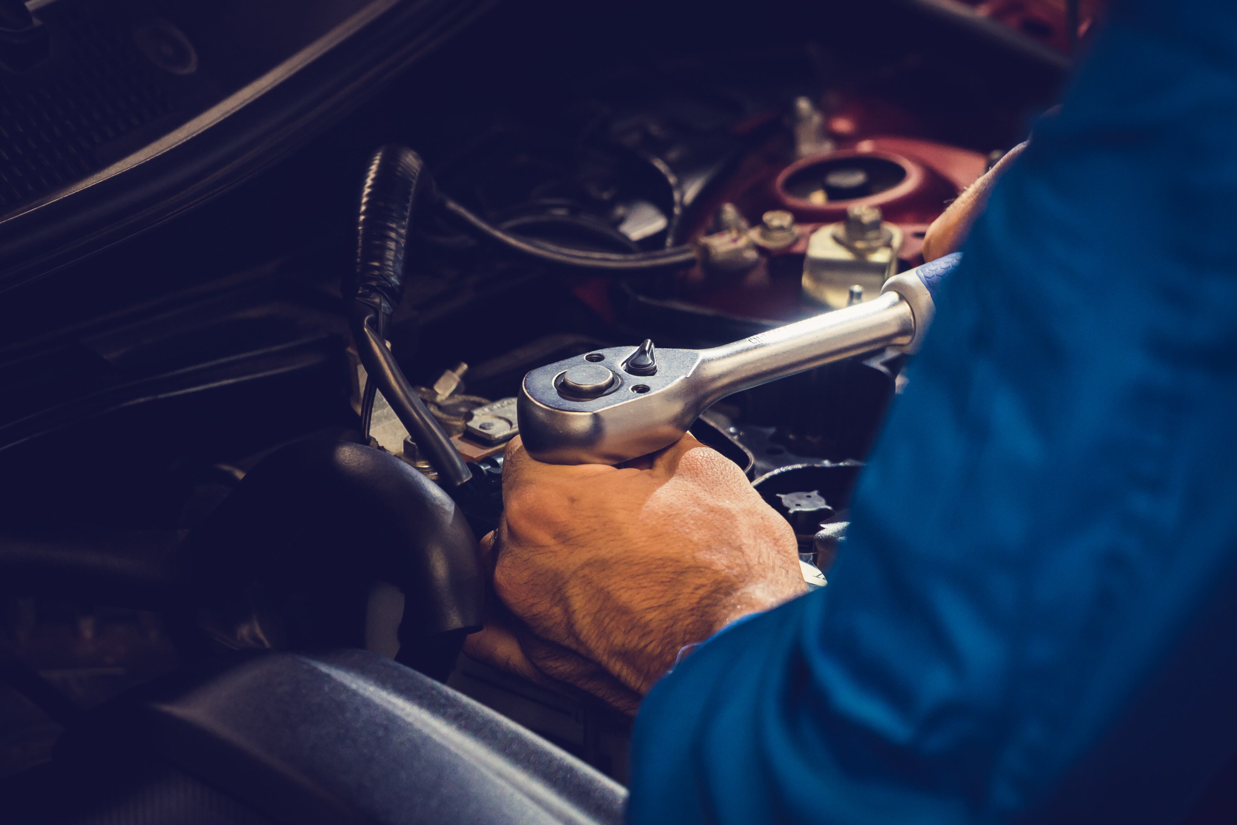 Mechanics checking and repairing the car. Car auto services concepts