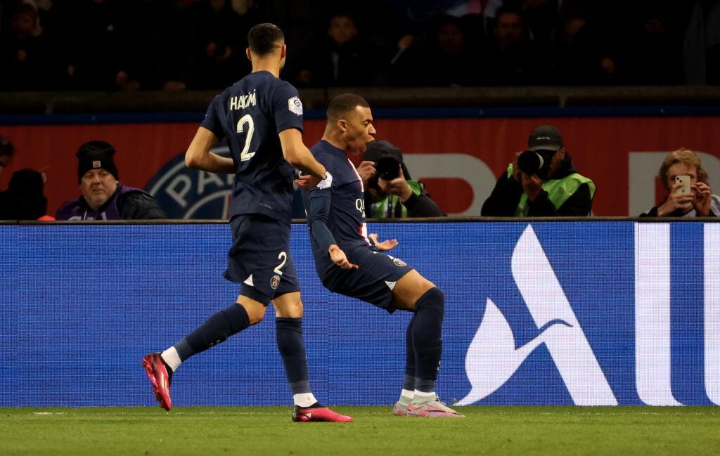 PARIS, FRANCE - APRIL 15: Kylian Mbappe of Paris Saint-Germain celebrates after scoring the team's first goal during the Ligue 1 match between Paris Saint-Germain and RC Lens at Parc des Princes on April 15, 2023 in Paris, France. (Photo by Xavier Laine/Getty Images)