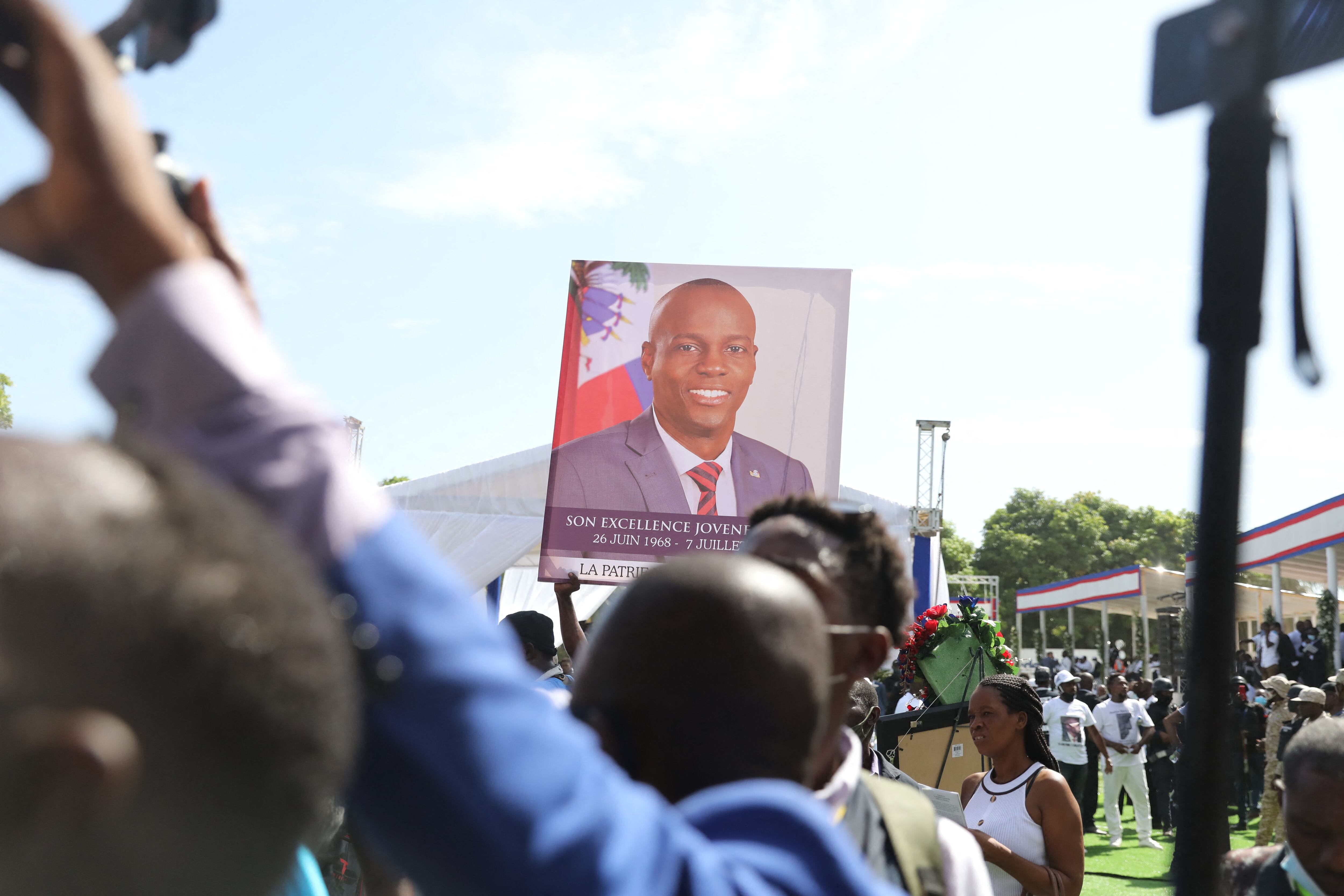 Mourners attend the funeral of slain Haitian President Jovenel Moïse on July 23, 2021, in Cap-Haitien, Haiti, the main city in his native northern region. - Moïse, 53, was shot dead in his home in the early hours of July 7. (Photo by Valerie Baeriswyl / AFP) (Photo by VALERIE BAERISWYL/AFP via Getty Images)