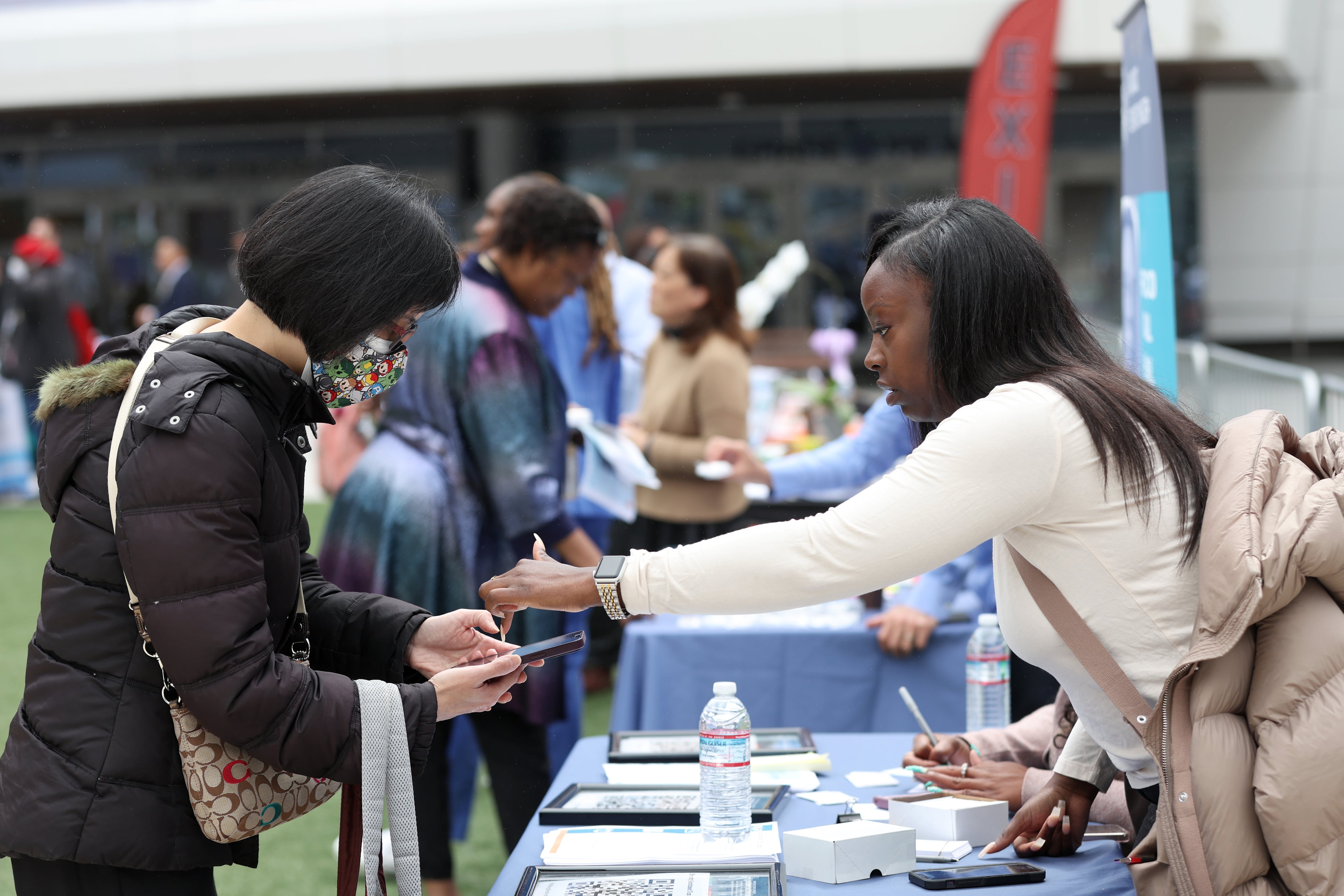 SAN FRANCISCO, CALIFORNIA - JUNE 03: A job seeker meets with a recruiter during the Healthcare Academy career and training fair outside of the Chase Center on June 03, 2022 in San Francisco, California. The Healthcare Academy held a career and training fair as employers added 390,000 jobs in May, according to the Bureau of Labor Statistics. The national unemployment rate remains at 3.6 percent. (Photo by Justin Sullivan/Getty Images)