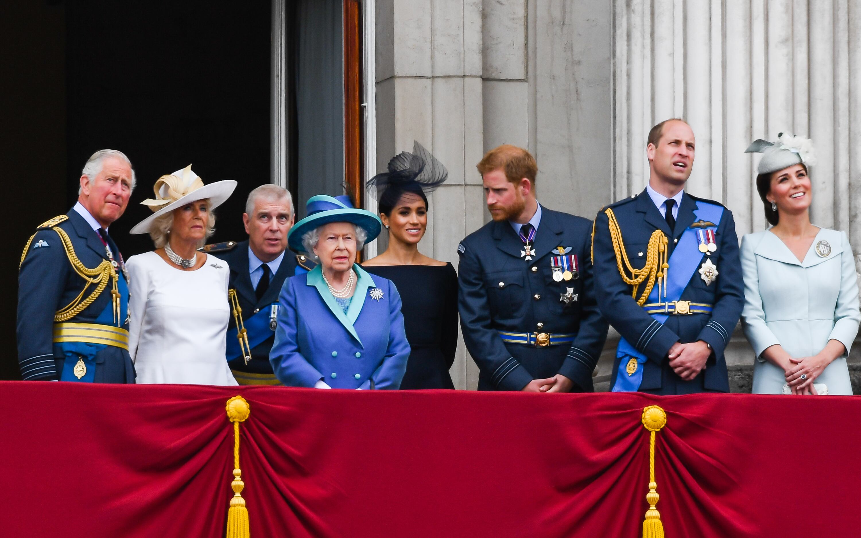 LONDON,  UNITED KINGDOM - JULY 1O:   Prince Charles, Prince of Wales, Camilla, Duchess of Cornwall, Prince Andrew, Duke of York,  Queen Elizabeth ll, Meghan, Duchess of Sussex, Prince Harry, Duke of Sussex, Prince William, Duke of Cambridge and Catherine, Duchess of Cambridge stand on the balcony of Buckingham Palace to view a flypast to mark the centenary of the Royal Air Force (RAF)  on July 10, 2018 in London, England. (Photo by Anwar Hussein/WireImage)