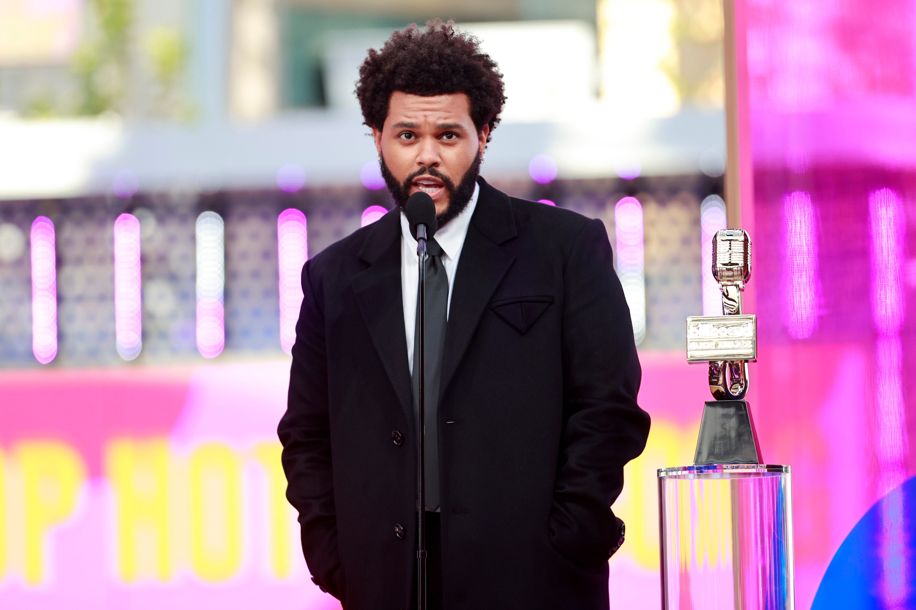 LOS ANGELES, CA - MAY 23:  2021 BILLBOARD MUSIC AWARDS -- Pictured: The Weeknd accepts Top Hot 100 Song for “Blinding Lights" onstage during the 2021 Billboard Music Awards held at the Microsoft Theater on May 23, 2021 in Los Angeles, California. --  (Photo by Emma McIntyre/NBC/NBCU Photo Bank via Getty Images)