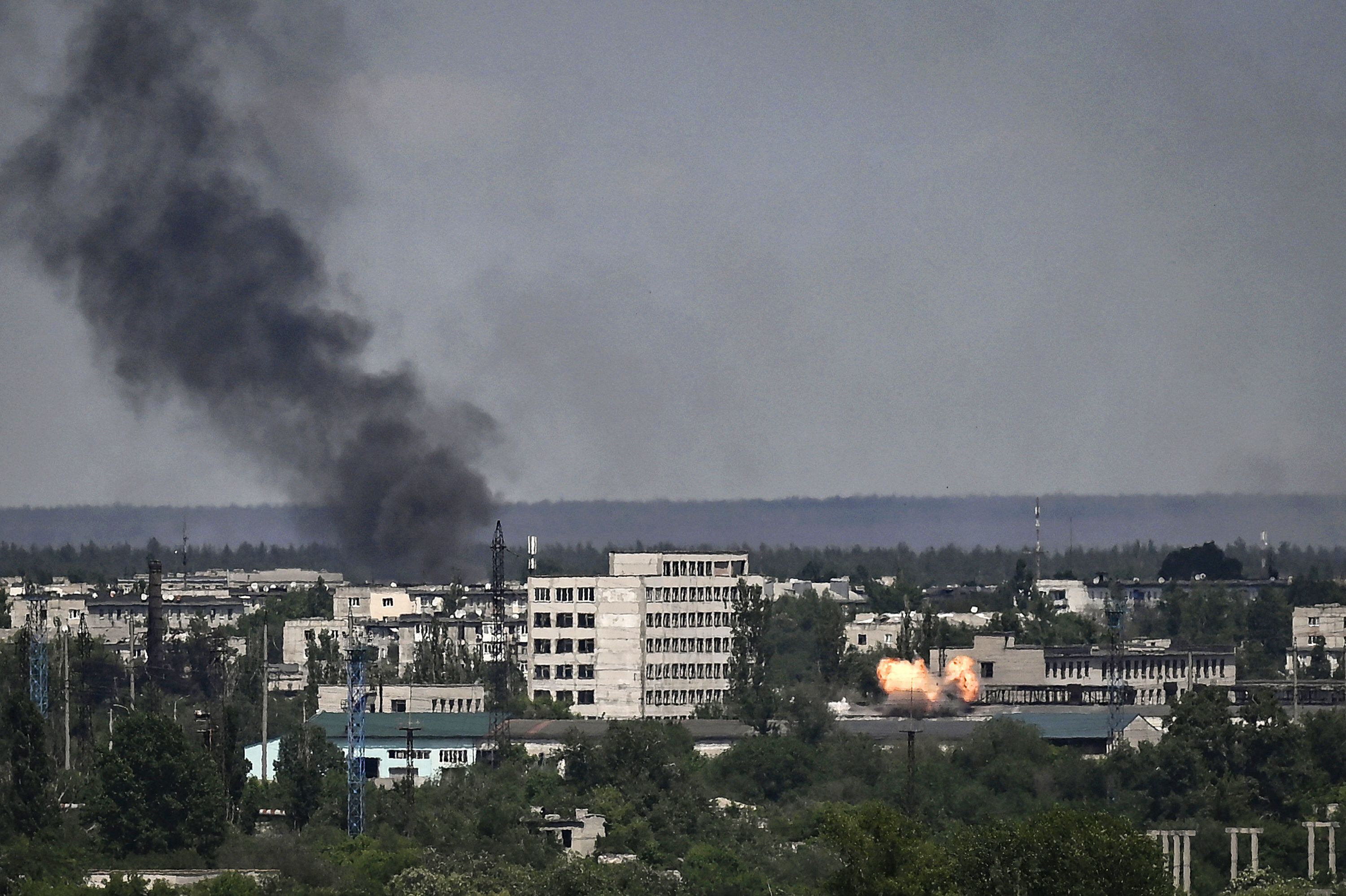 A photograph shows an explosion in the city of Severodonetsk during heavy fightings between Ukrainian and Russian troops at eastern Ukrainian region of Donbas on May 30, 2022, on the 96th day of the Russian invasion of Ukraine. (Photo by ARIS MESSINIS / AFP) (Photo by ARIS MESSINIS/AFP via Getty Images)
