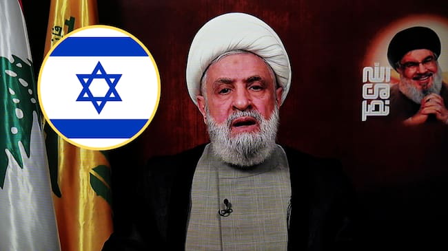 Sheikh Naim Qassem, líder de Hizbulá, bandera de Israel. Foto: EFE/EPA/WAEL HAMZEH/Getty Images