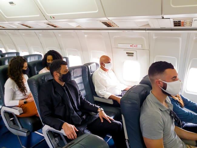 Photo of passengers flying using protective face masks. Photo: Getty Images