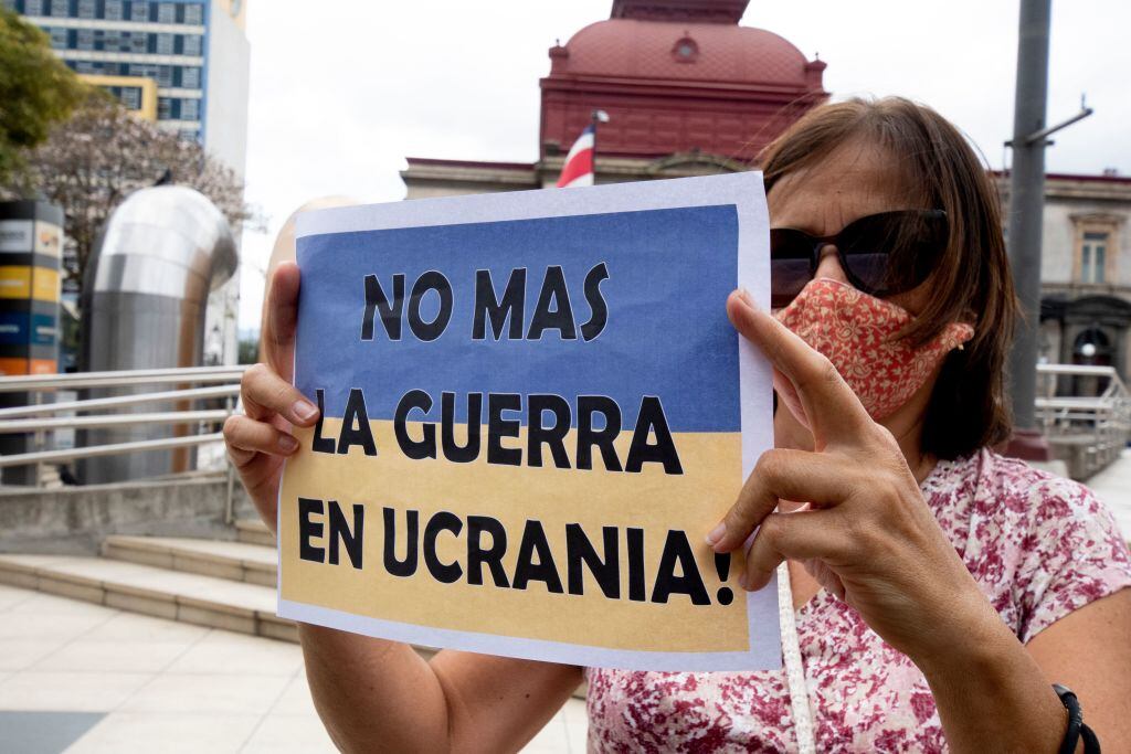 A Ukrainian citizen holds a sign reading No more war in Ukraine. (Photo by Ezequiel BECERRA / AFP) (Photo by EZEQUIEL BECERRA/AFP via Getty Images)