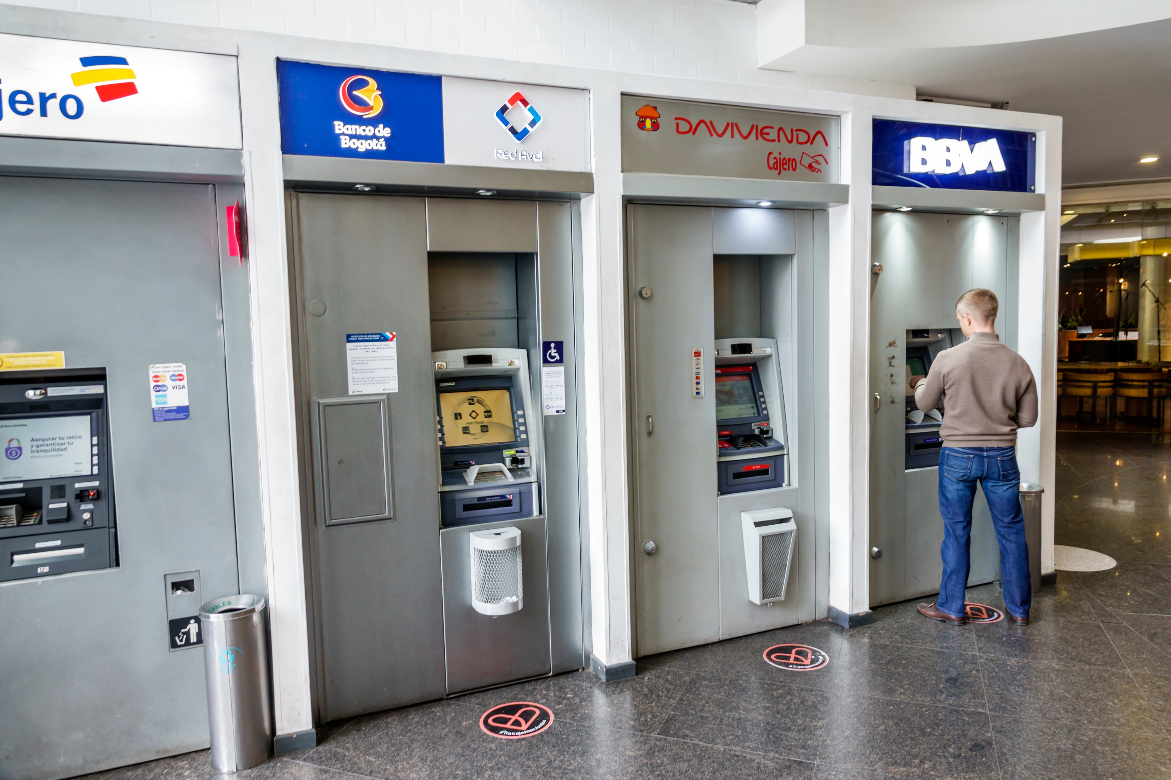 Bogota, Colombia, El Chico, BBVA Cajero Centro Commercial Portobelo ATM, Banco de Bogota Davivienda, man using ATM. (Jeffrey Greenberg/Universal Images Group via Getty Images)