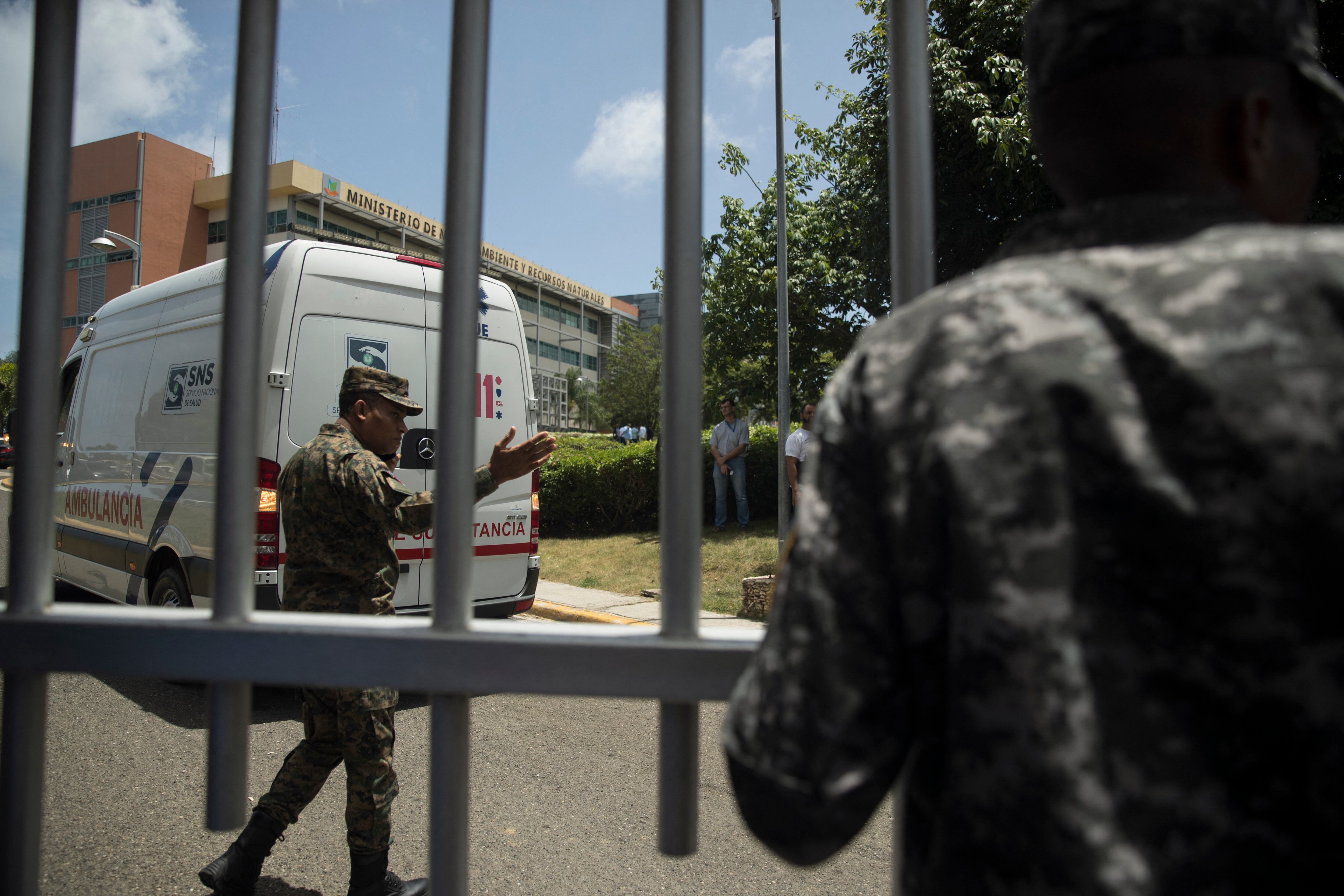 An ambulance enters the Dominican Ministry of Environment headquarters during a shooting, in Santo Domingo, on June 6, 2022. - Dominican Minister of Environment Orlando Jorge Mera was shot dead at his office Monday. (Photo by Erika SANTELICES / AFP)