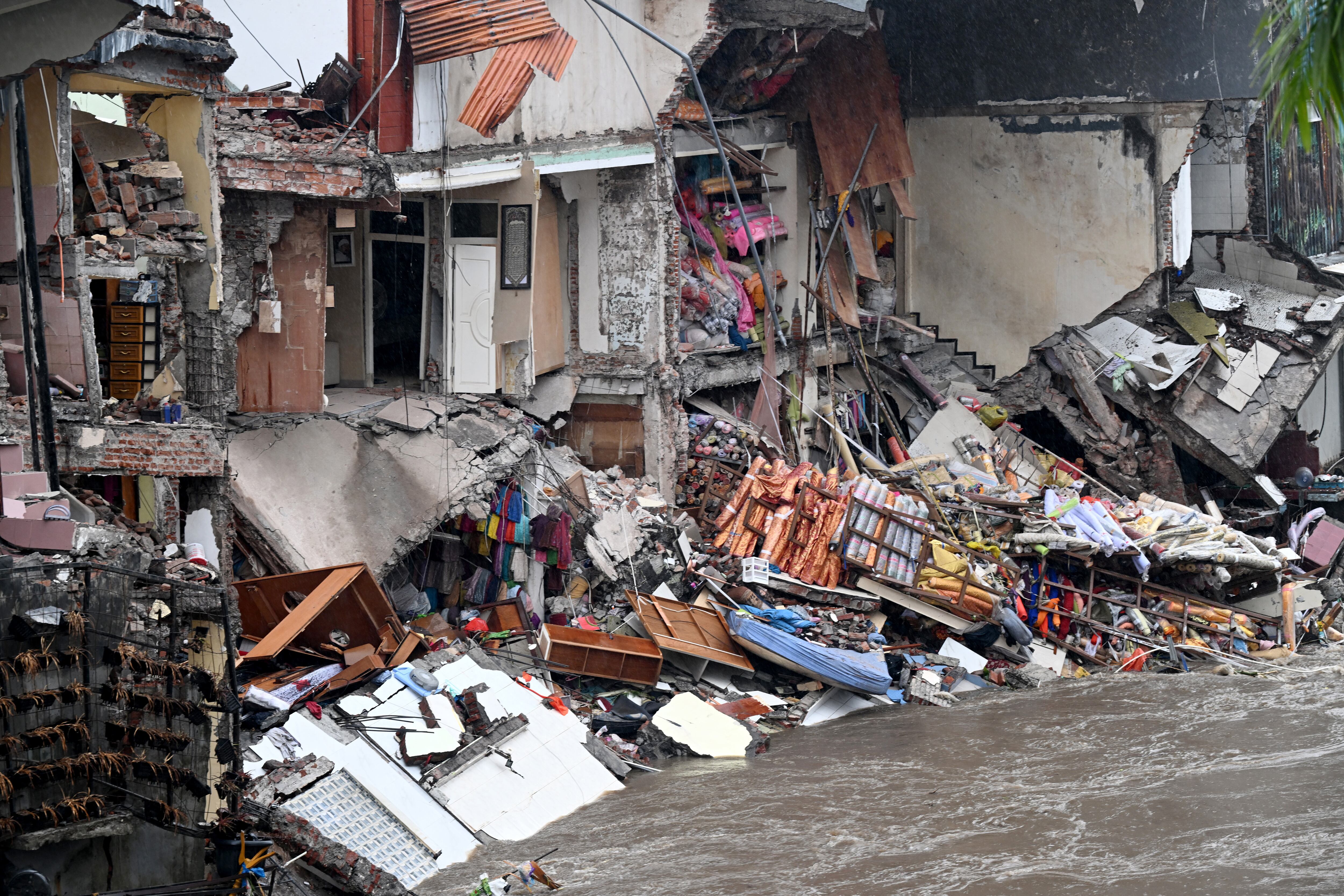 Casas destruidas por inundaciones en Bali. Foto: SONNY TUMBELAKA/AFP via Getty Images
