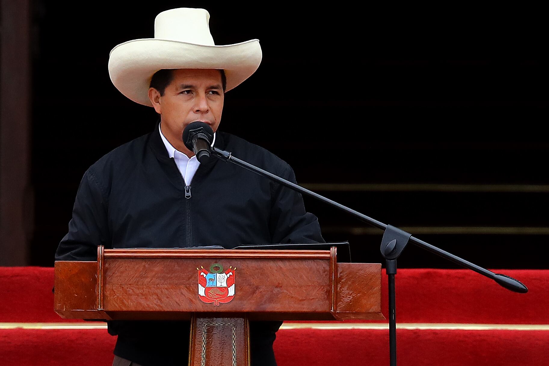 LIMA, PERU - DECEMBER 05: Peruvian President Pedro Castillo speaks during an event to deliver firetrucks to Volunteer firefighters of Peru on December 5, 2021 in Lima, Peru. After only four months in power, National Congress will vote this week on whether to start the formal impeachment process to Castillo. The Left-wing President will also be questioned by prosecutors on December 14th over promotions for military officers. (Photo by Leonardo Fernandez/Getty Images)