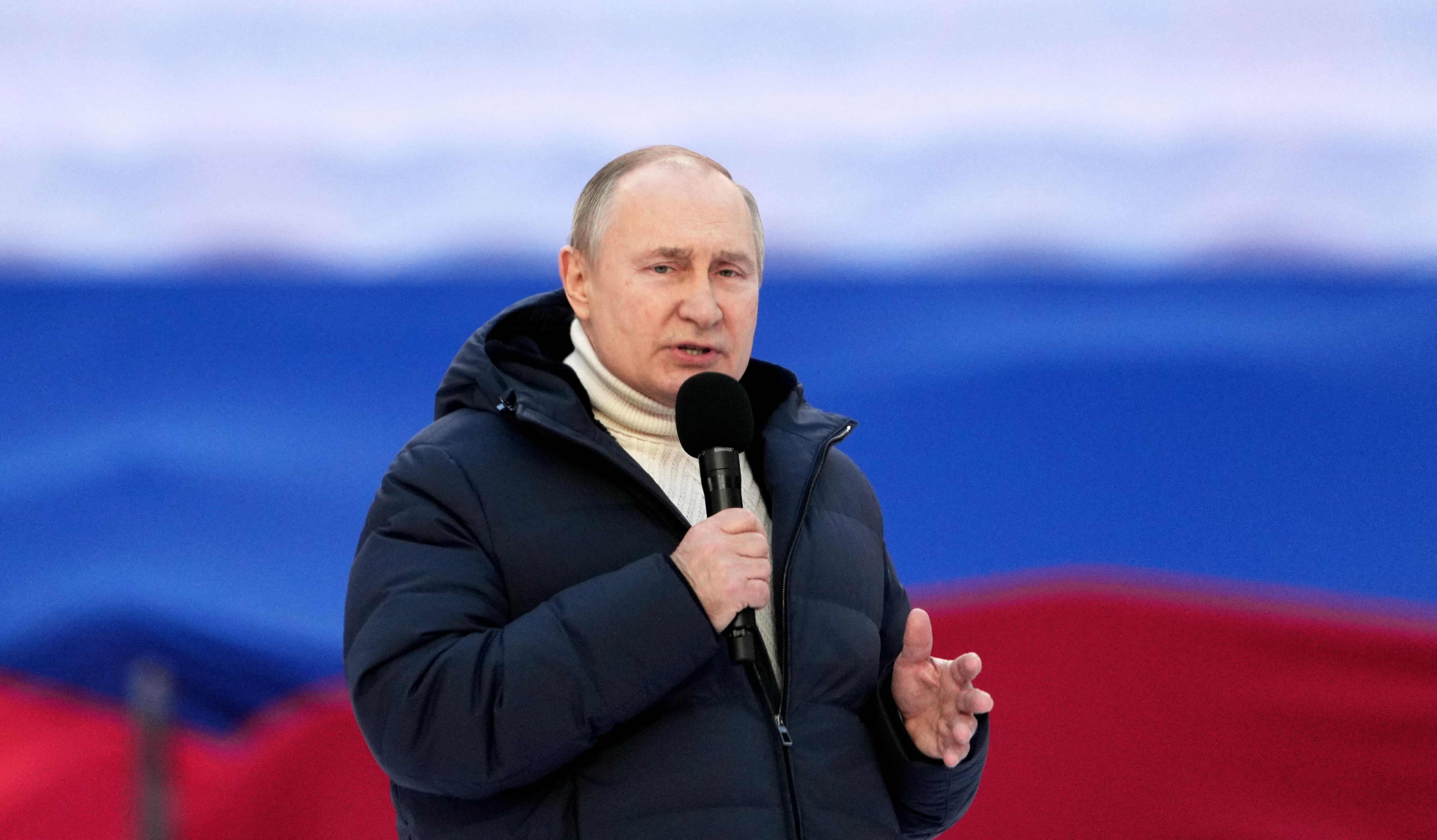 Russian President Vladimir Putin gives a speech at a concert marking the eighth anniversary of Russia's annexation of Crimea at the Luzhniki stadium in Moscow on March 18, 2022. (Photo by Alexander VILF / POOL / AFP) (Photo by ALEXANDER VILF/POOL/AFP via Getty Images)