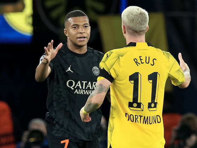 Kylian Mbappe del PSG y Marco Reus de Dortmund. Foto: EFE