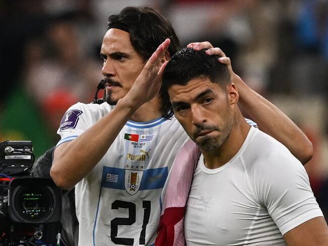 Cavani y Suarez, Mundial Qatar (Photo by Pablo PORCIUNCULA / AFP) (Photo by PABLO PORCIUNCULA/AFP via Getty Images)