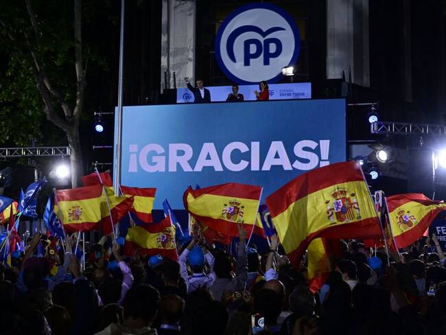 Popular Party (PP) supporters wave flags as they gather to celebrate the polls result outside the party headquarters in Madrid on May 28, 2023 after the local and regional elections held in Spain. Spain&#039;s right-wing opposition posted strong gains both locally and regionally following today&#039;s polls in a clear setback for Socialist Prime Minister, initial results and media reports said.  At a local level, the main opposition Popular Party secured the largest number of votes with 90 percent of the ballots counted, while the Socialists lost several regions they held, notably Valencia, media reports said. (Photo by JAVIER SORIANO / AFP) (Photo by JAVIER SORIANO/AFP via Getty Images)