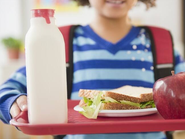 De los más de 5'600.000 estudiantes que se benefician del PAE, al momento solo 1,2 millones reciben alimentación. Foto: Getty Images / JAMIE GRILL