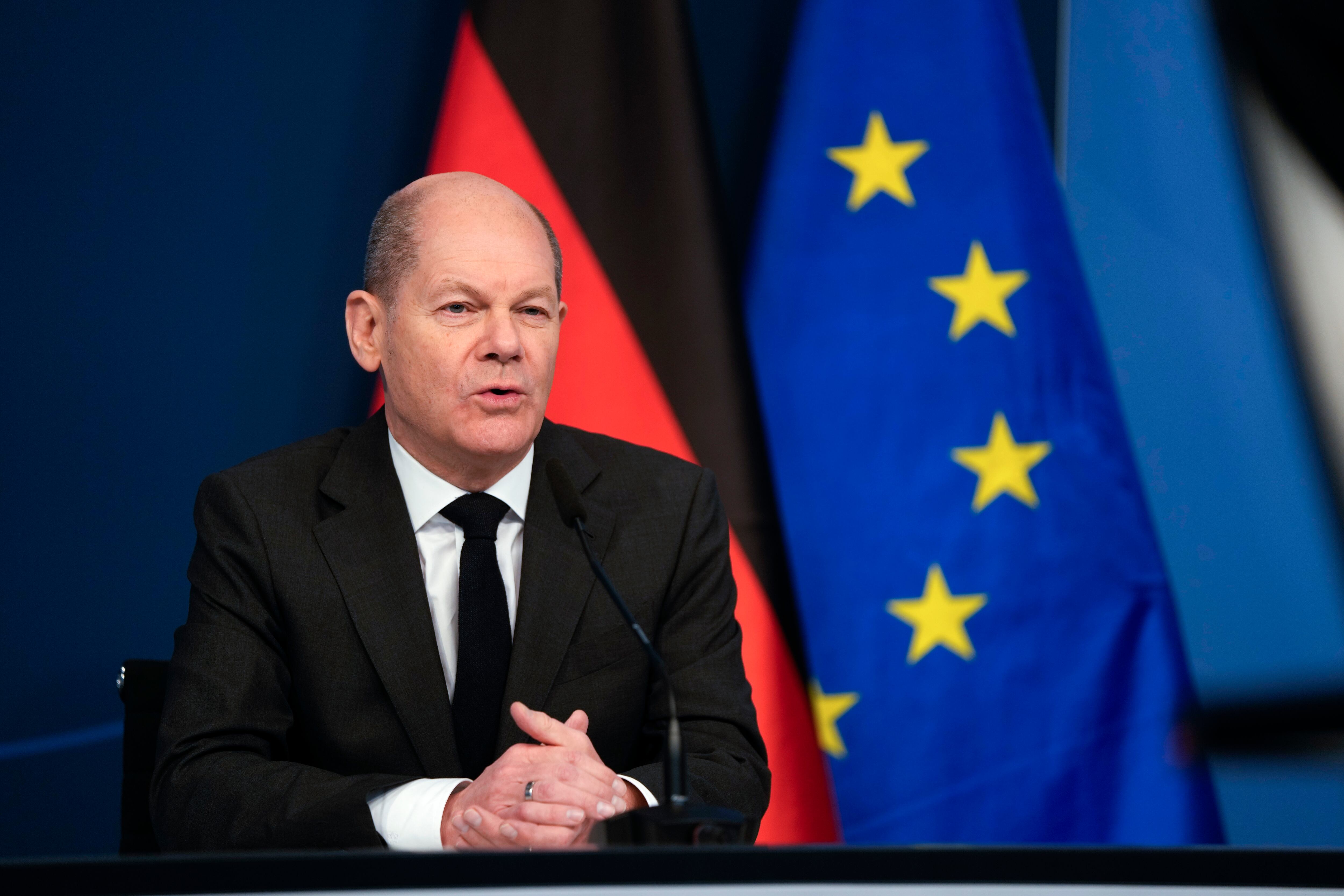 BERLIN, GERMANY - JANUARY 19: German Chancellor Olaf Scholz sits in front of a camera as he delivers his speech for the Davos Agenda 2022 at the chancellery on January 19, 2022 in Berlin, Germany. The Davos Agenda, which takes place from January 17 to January 21, 2022, is an online edition of the annual Davos meeting of the World Economy Forum due to the coronavirus pandemic. (Photo by Markus Schreiber - Pool/Getty Images)