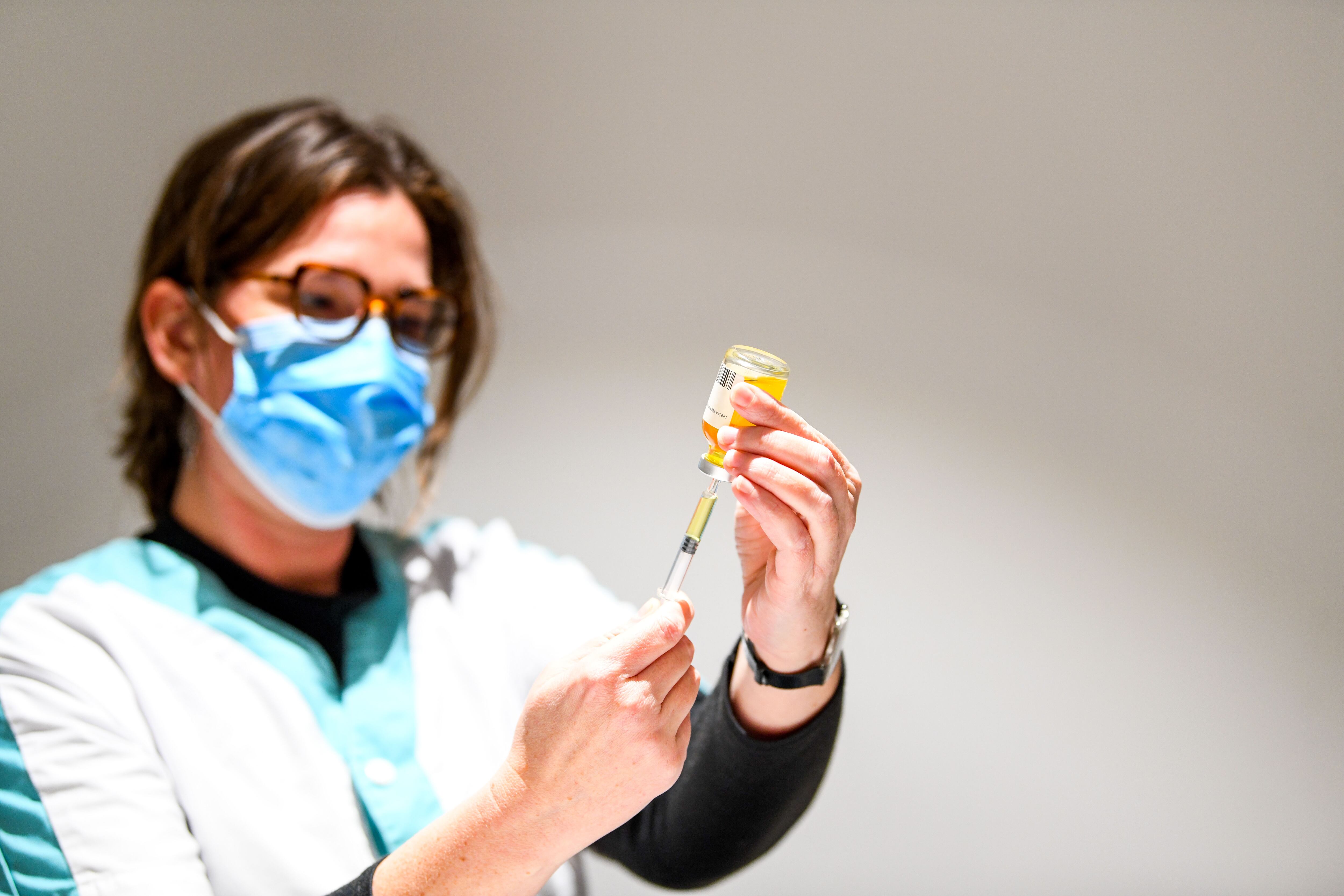 Vaccine. Nurse preparing a syringe for an injection. (Photo by: Tesson/Andia/Universal Images Group via Getty Images)