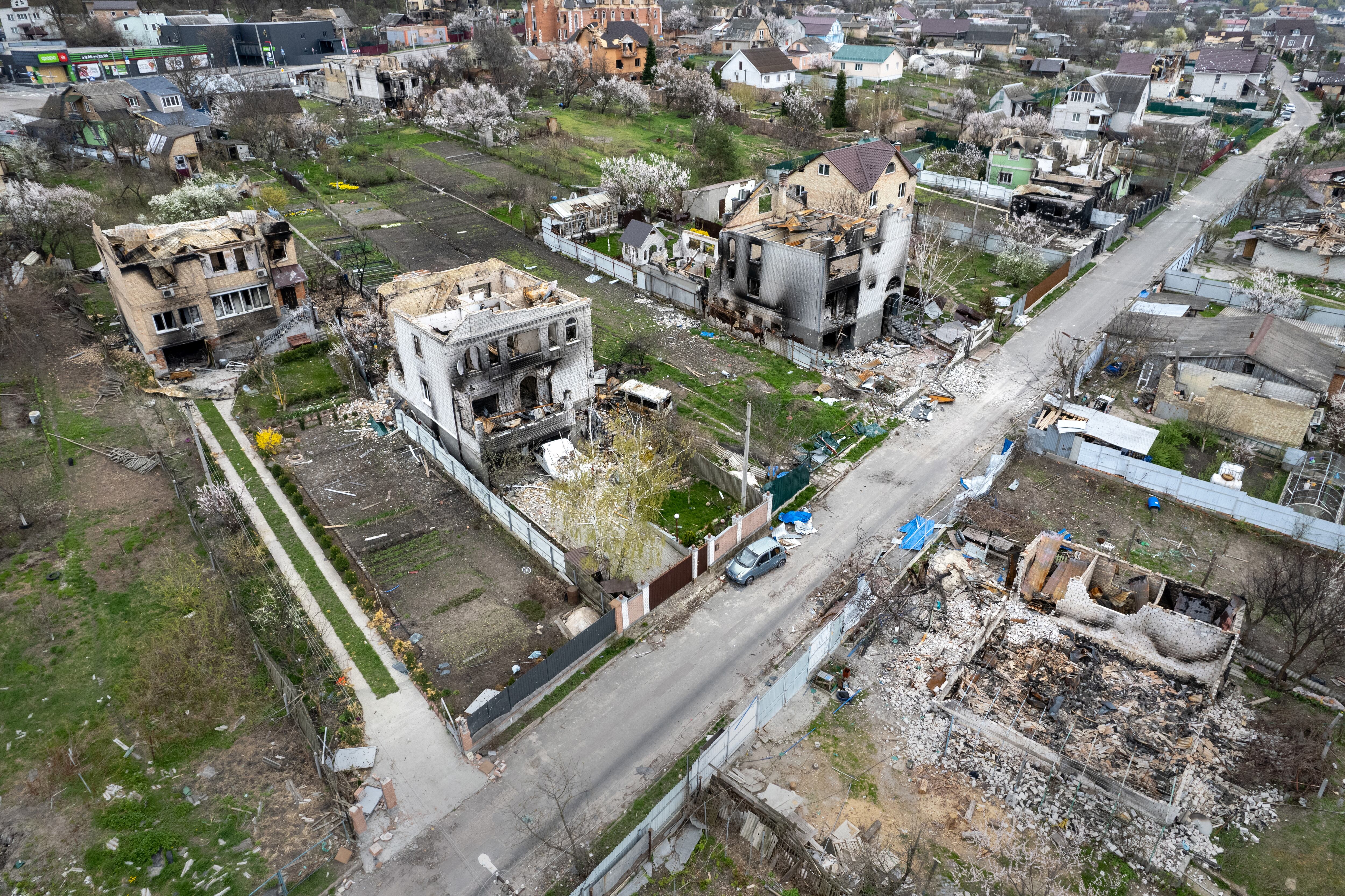 GOSTOMEL, UKRAINE - APRIL 25: As seen from the air, wrecked homes stand near the former frontline between Russian and Ukrainian troops on April 25, 2022 in Gostomel, Ukraine. As Russia concentrates its attack on the east and south of the country, residents of the Kyiv region are returning to assess the war's toll on their communities. (Photo by John Moore/Getty Images)