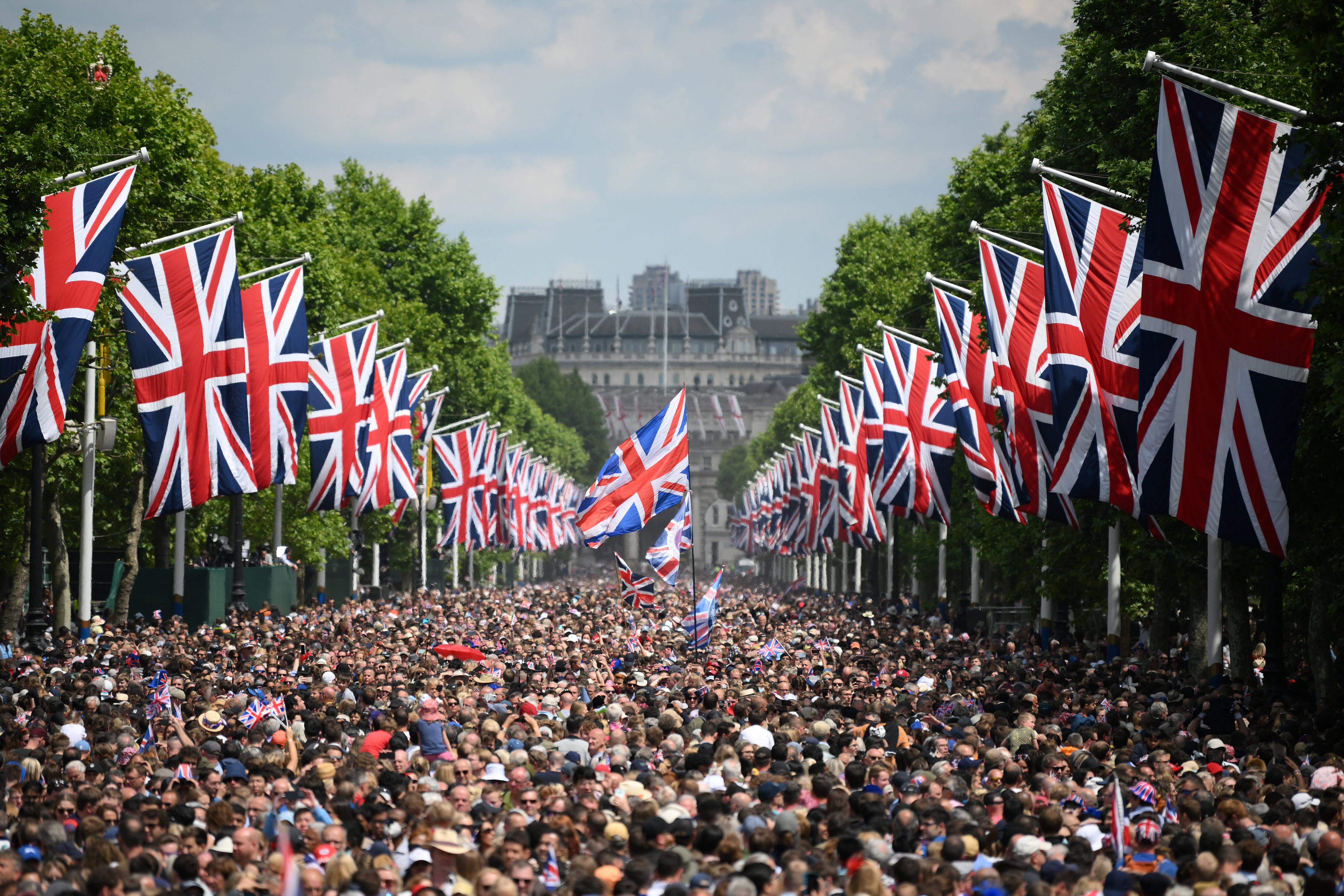 Members of the public fill The Mall before a flypast during the Queen's Birthday Parade, the Trooping the Colour, as part of Queen Elizabeth II's Platinum Jubilee celebrations, in London on June 2, 2022. (Photo by Daniel LEAL / various sources / AFP)