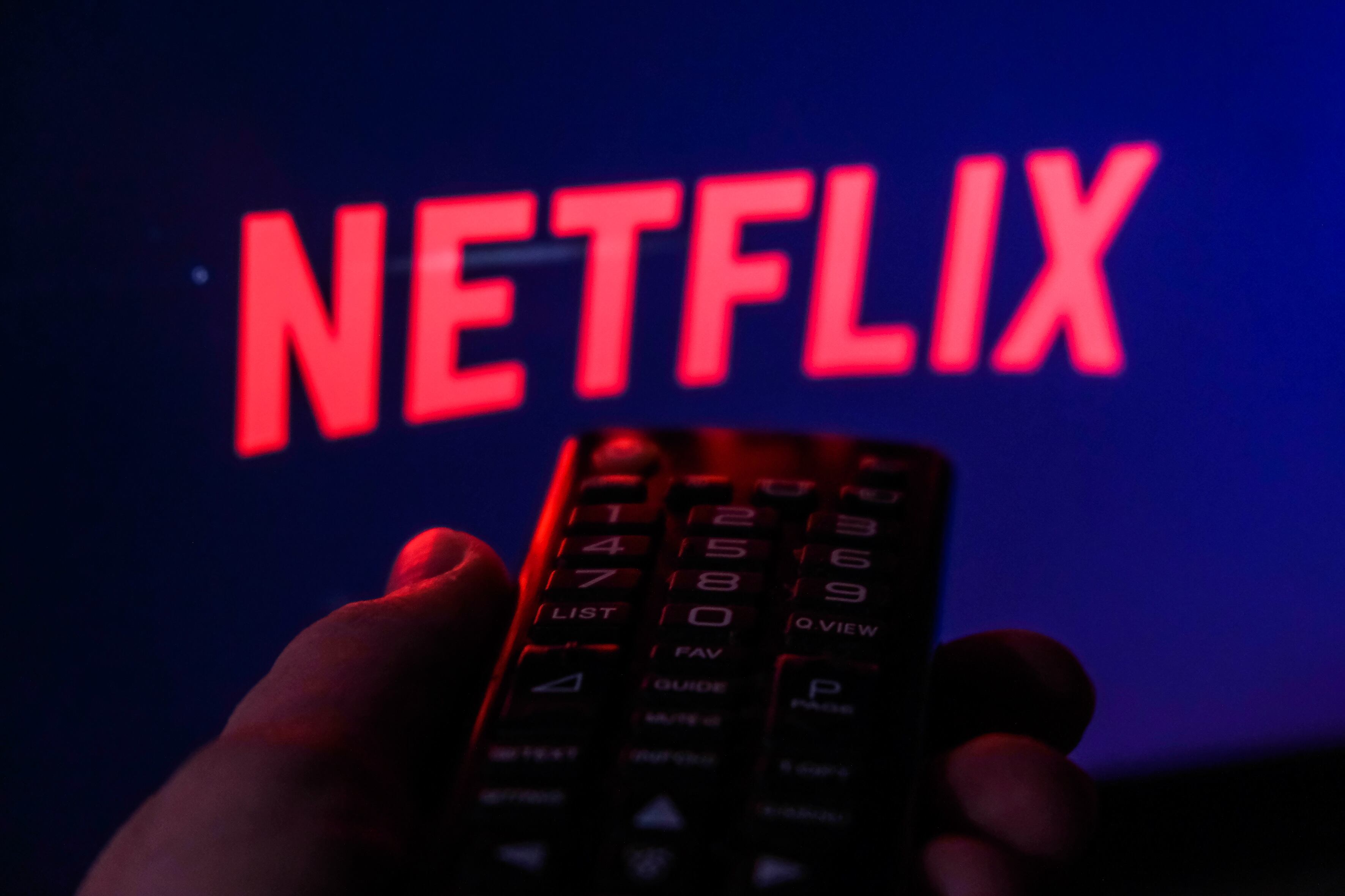 TV remote control is seen with Netflix logo displayed on a screen in this illustration photo taken in Krakow, Poland on February 6, 2022. (Photo by Jakub Porzycki/NurPhoto via Getty Images)