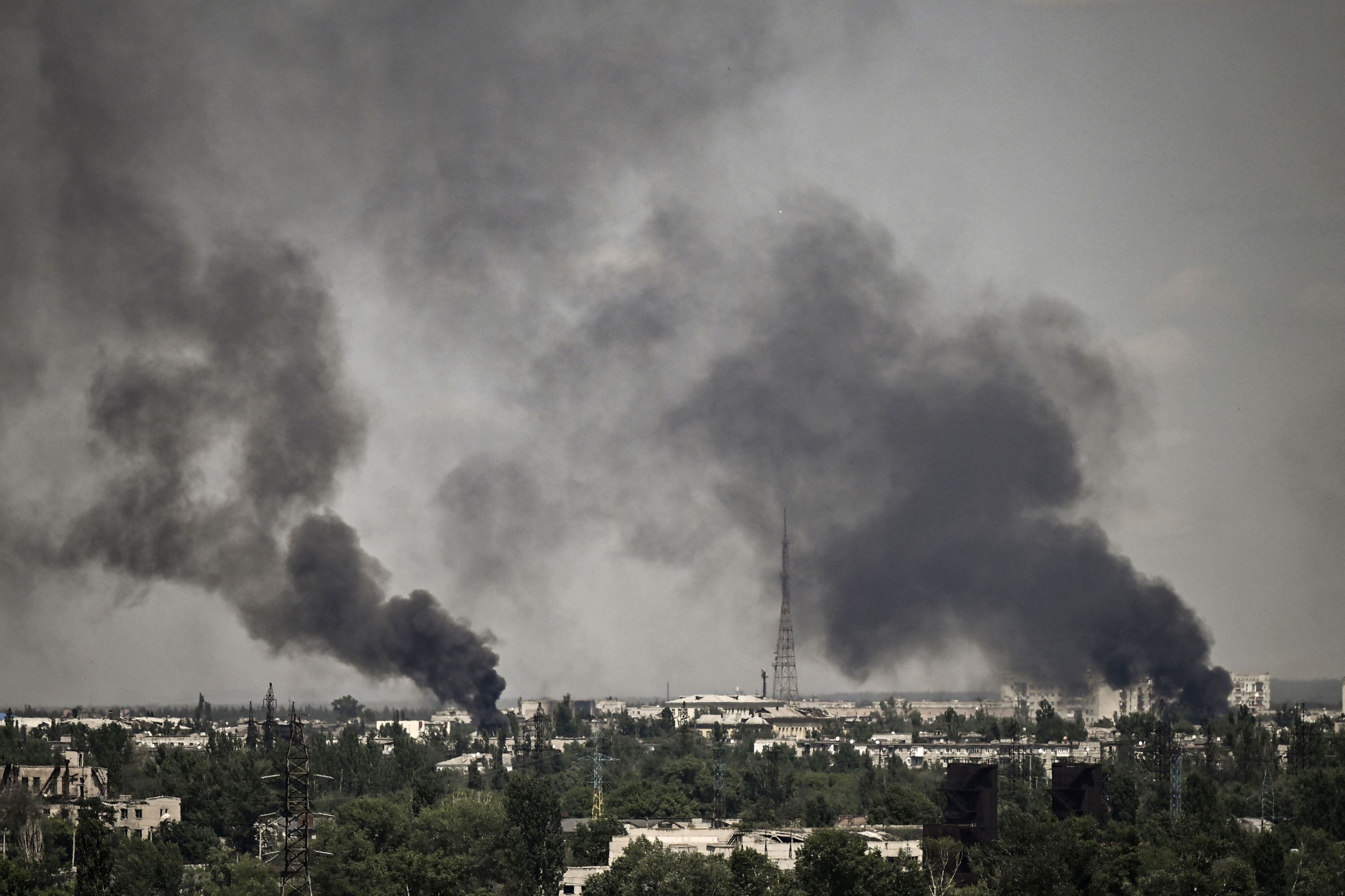 Smoke rises in the city of Severodonetsk during heavy fightings between Ukrainian and Russian troops at eastern Ukrainian region of Donbas on May 30, 2022, on the 96th day of the Russian invasion of Ukraine. (Photo by ARIS MESSINIS / AFP) (Photo by ARIS MESSINIS/AFP via Getty Images)