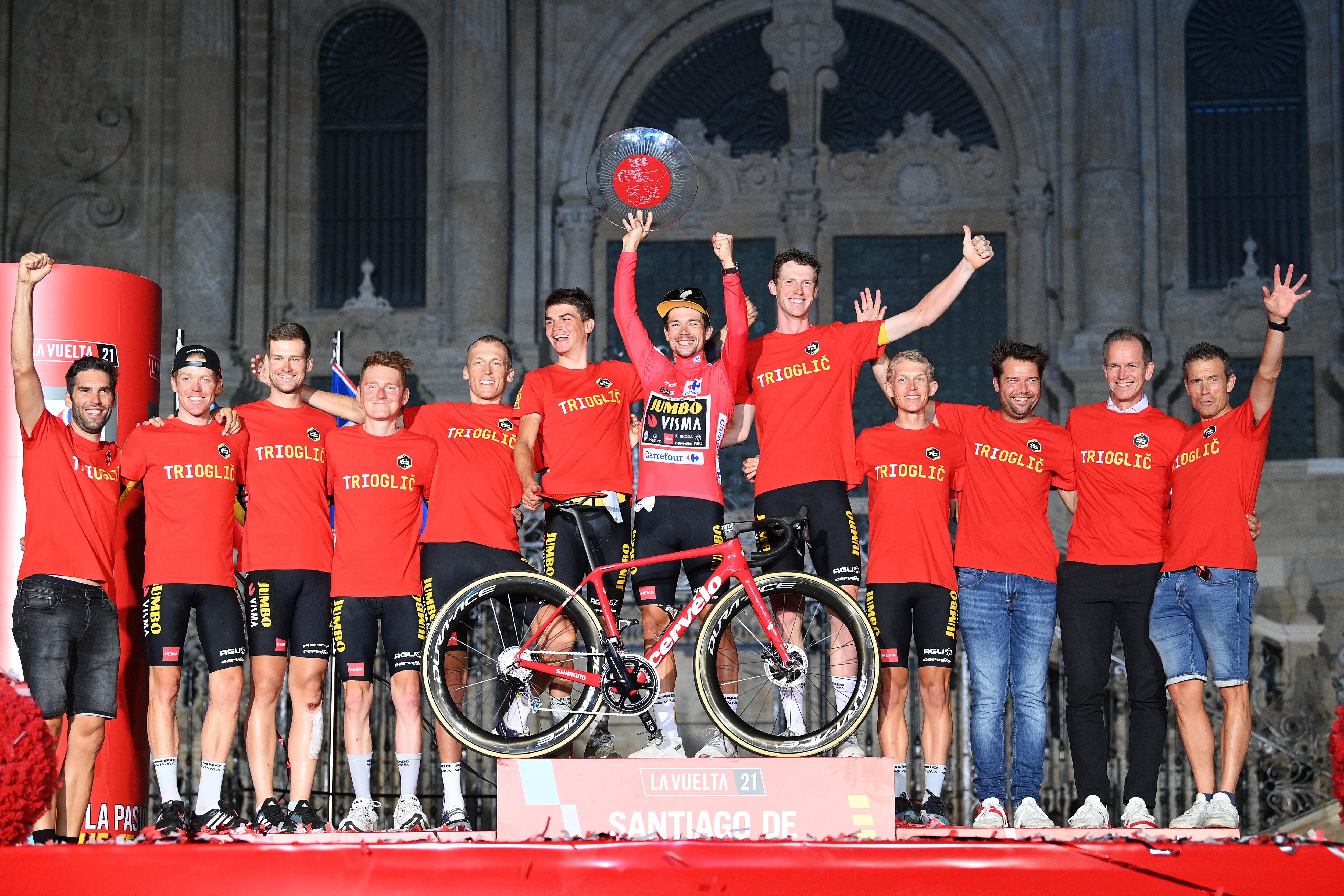 SANTIAGO DE COMPOSTELA, SPAIN - SEPTEMBER 05: Team Jumbo - Visma celebrate winning on the podium ceremony in the Plaza del Obradoiro with the Cathedral in the background after the 76th Tour of Spain 2021, Stage 21 a 33,8 km Individual Time Trial stage from Padrón to Santiago de Compostela / @lavuelta / #LaVuelta21 / ITT / on September 05, 2021 in Santiago de Compostela, Spain. (Photo by Stuart Franklin/Getty Images)