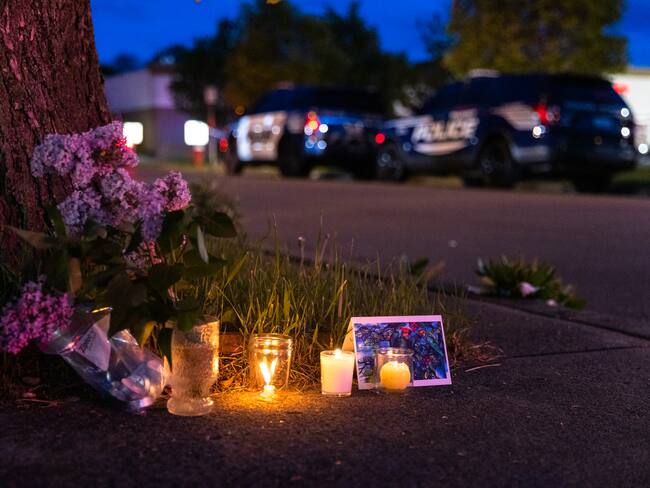 BUFFALO, NY - MAY 14: A small vigil set up across the street from a Tops grocery store on Jefferson Avenue in Buffalo, where a heavily armed 18-year-old White man entered the store in a predominantly Black neighborhood and shot 13 people, killing ten, Saturday, May 14, 2022. (Matt Burkhartt for The Washington Post via Getty Images)